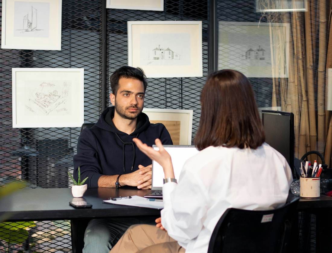 Two people in a friendly one-to-one conversation
